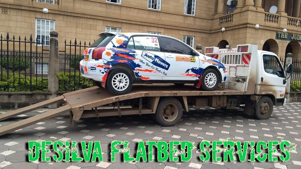 Motor sport car towing by Desilva Towing & Recovery Company